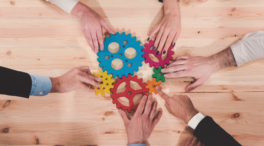 Image showing hands putting together a set of gears