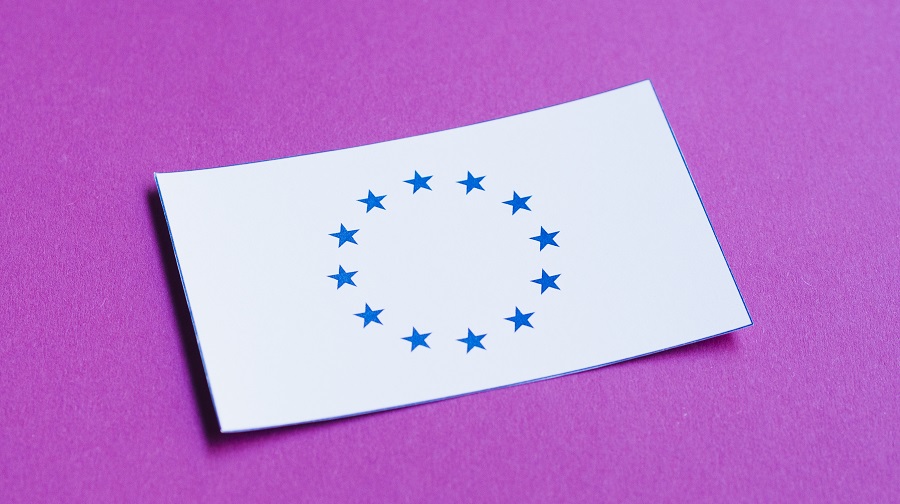 White card with the EU flag on a purple background