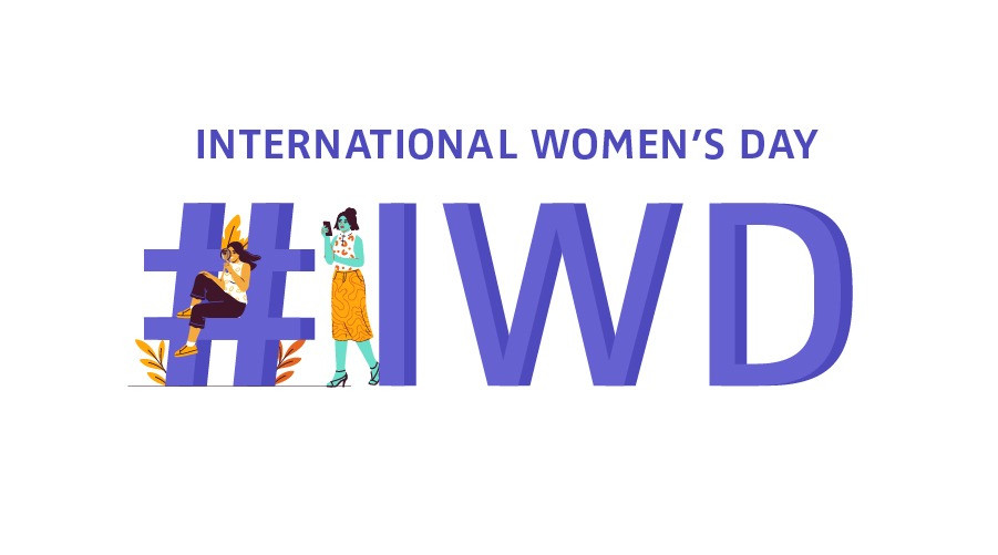 'International Women's Day' and '#IWD' written on large block letters with drawn female characters sitting and looking optimistic on the hashtag