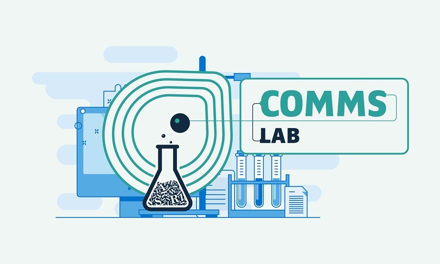 Comms Lab Central in an image is a flask in chemistry laboratory filled with words and letters. Title Comms Lab is added to the flask
