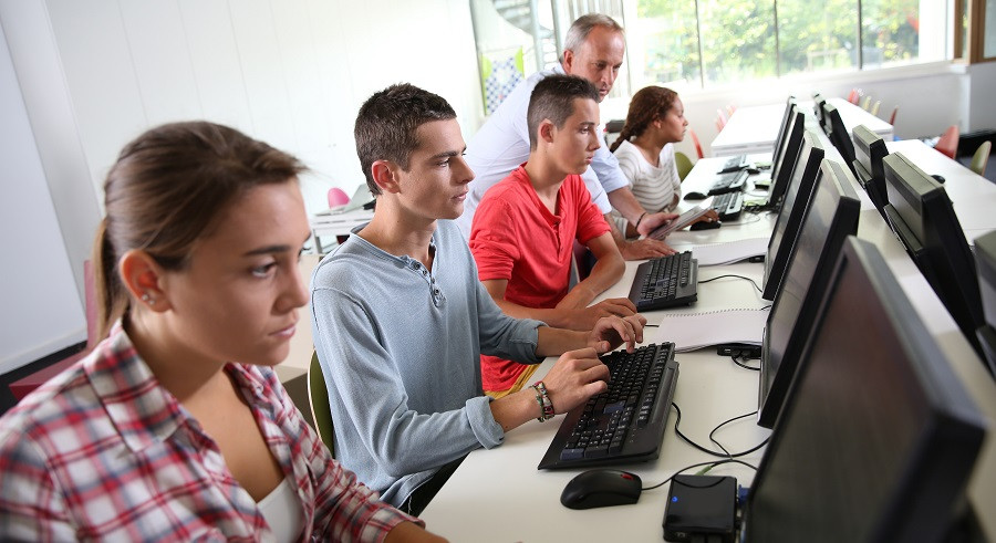 Group of young people in computing class